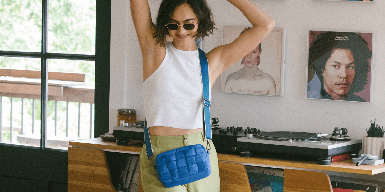 Girl model wearing blue crossbody bag