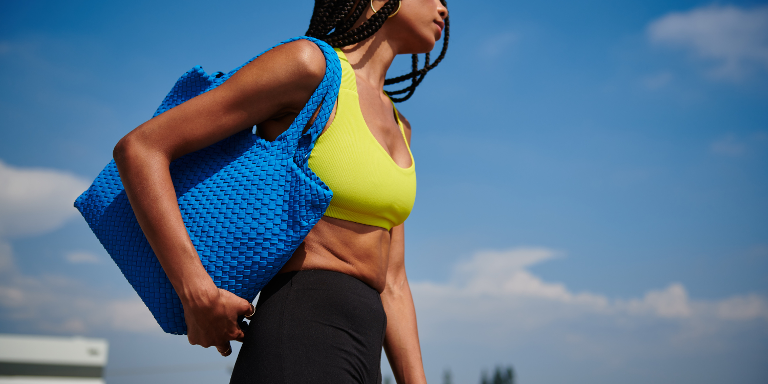 a model in a workout set with a backpack