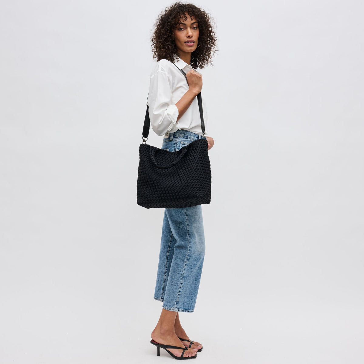 Woman wearing Black Sol and Selene Sky&#39;s The Limit - Medium Black Tote 841764111294 View 4 | Black 