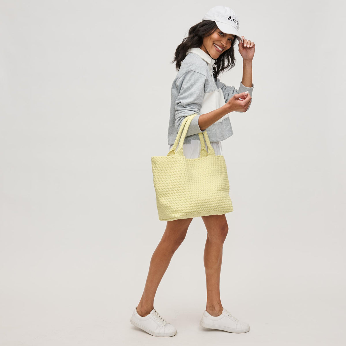 Woman wearing Butter Sol and Selene Sky&#39;s The Limit - Medium Butter Tote 841764111294 View 3 | Butter