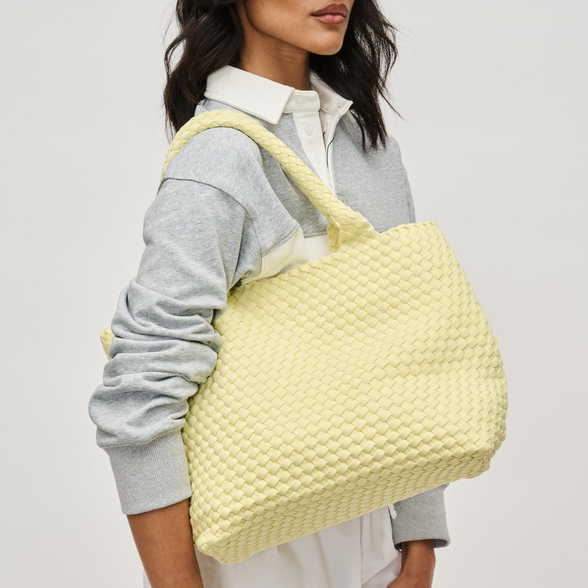 Woman wearing Butter Sol and Selene Sky&#39;s The Limit - Medium Butter Tote 841764111294 View 2 | Butter