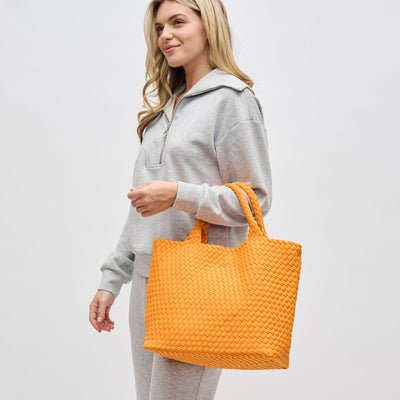 Woman wearing Orange Sol and Selene Sky's The Limit - Medium Orange Tote 841764111294 View 1 | Orange