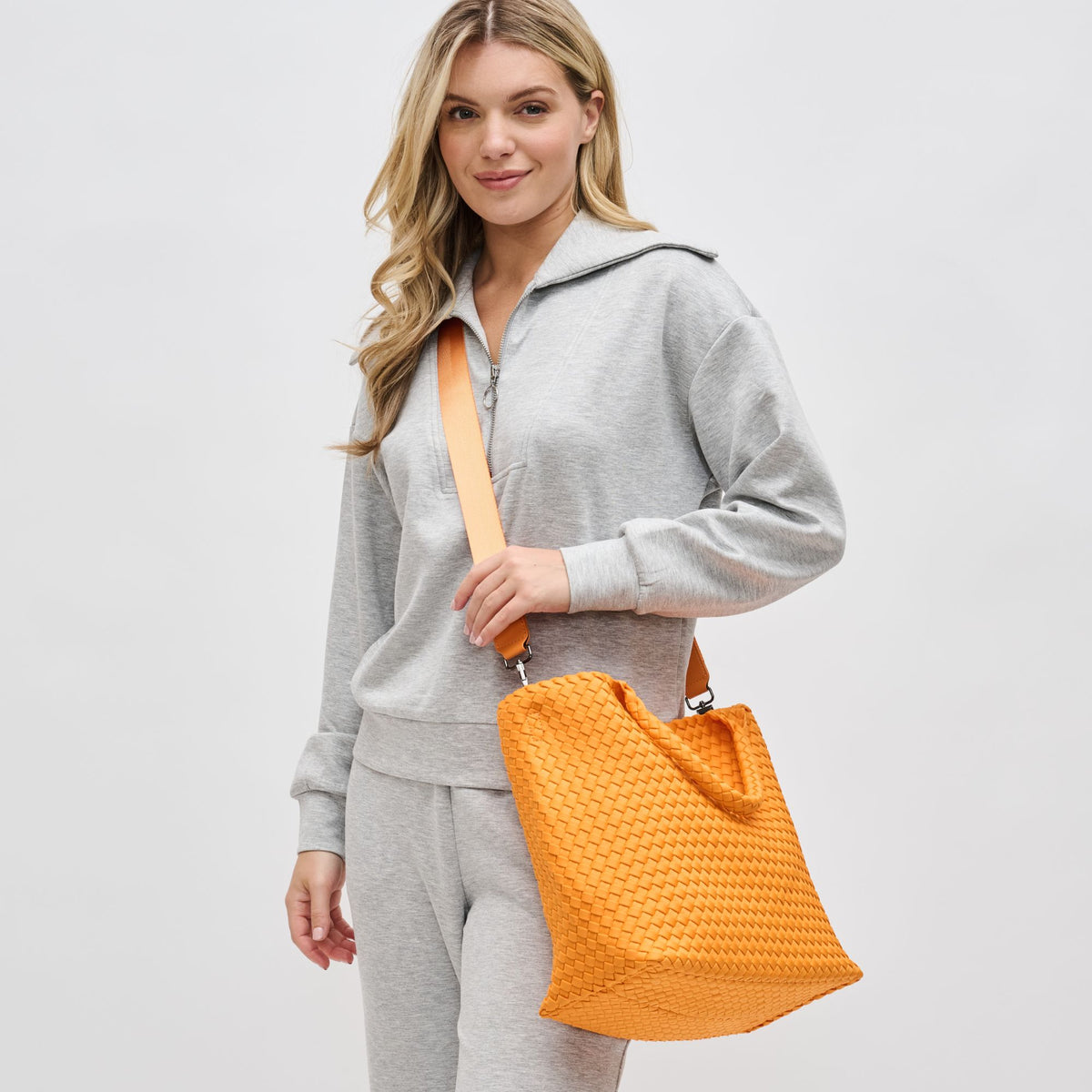 Woman wearing Orange Sol and Selene Sky&#39;s The Limit - Medium Orange Tote 841764111294 View 2 | Orange