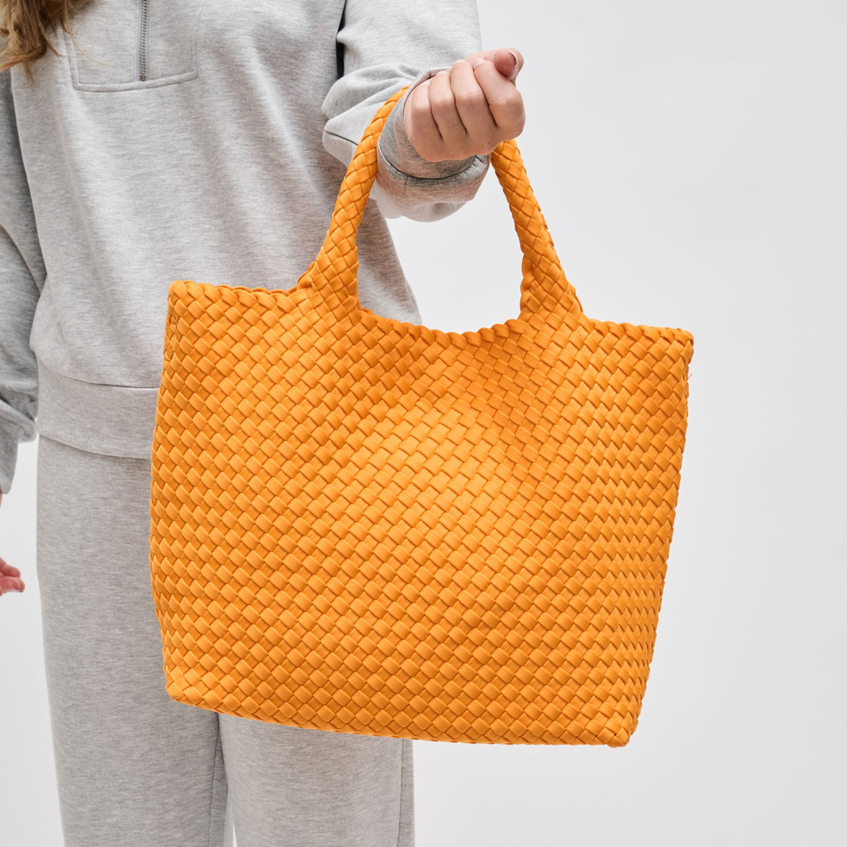 Woman wearing Orange Sol and Selene Sky&#39;s The Limit - Medium Orange Tote 841764111294 View 4 | Orange