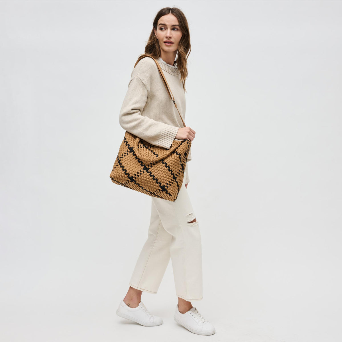 Woman wearing Sand Black Sol and Selene Sky&#39;s The Limit - Medium Sand Black Tote 841764111294 View 4 | Sand Black