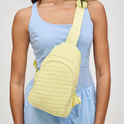 Woman wearing Butter Sol and Selene Beyond The Horizon - Woven Neoprene Sling Backpack 841764108034 View 1 | Butter