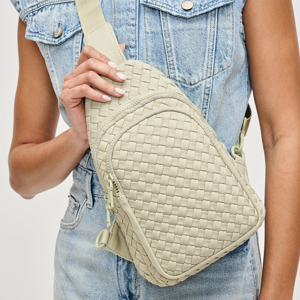 Woman wearing Sage Sol and Selene Beyond The Horizon - Woven Neoprene Sling Backpack 841764108034 View 1 | Sage