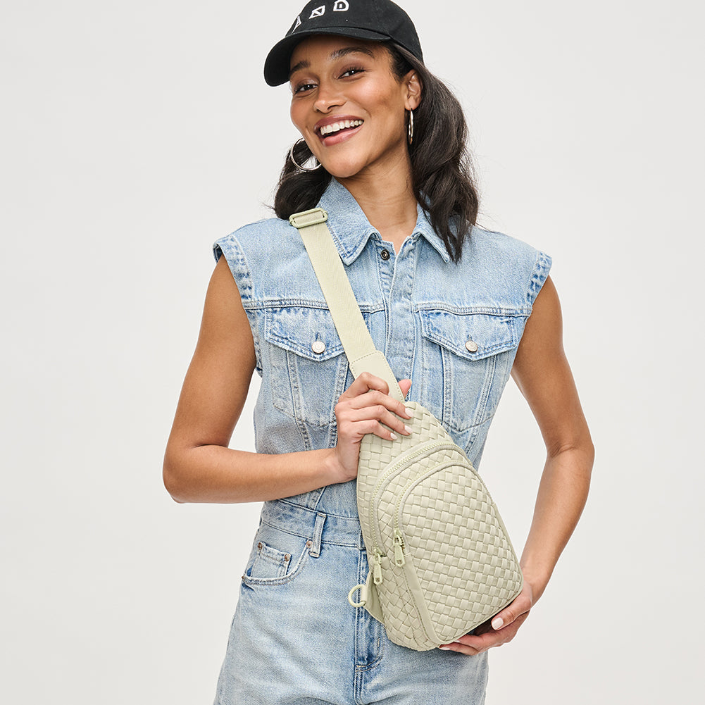 Woman wearing Sage Sol and Selene Beyond The Horizon - Woven Neoprene Sling Backpack 841764108034 View 2 | Sage