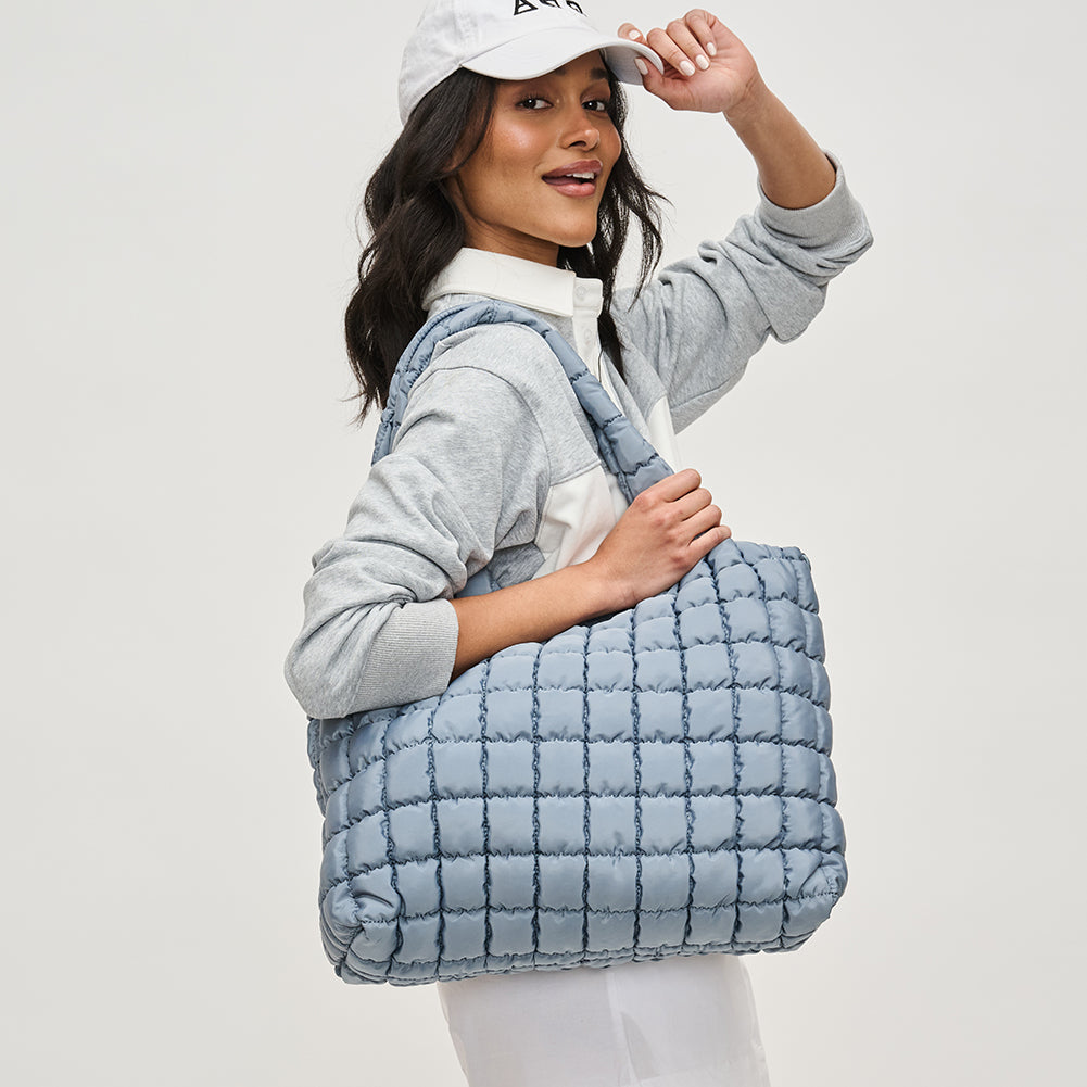 Woman wearing Sol and Selene Elevate Hobo 841764111898 View 2 | Slate Sky