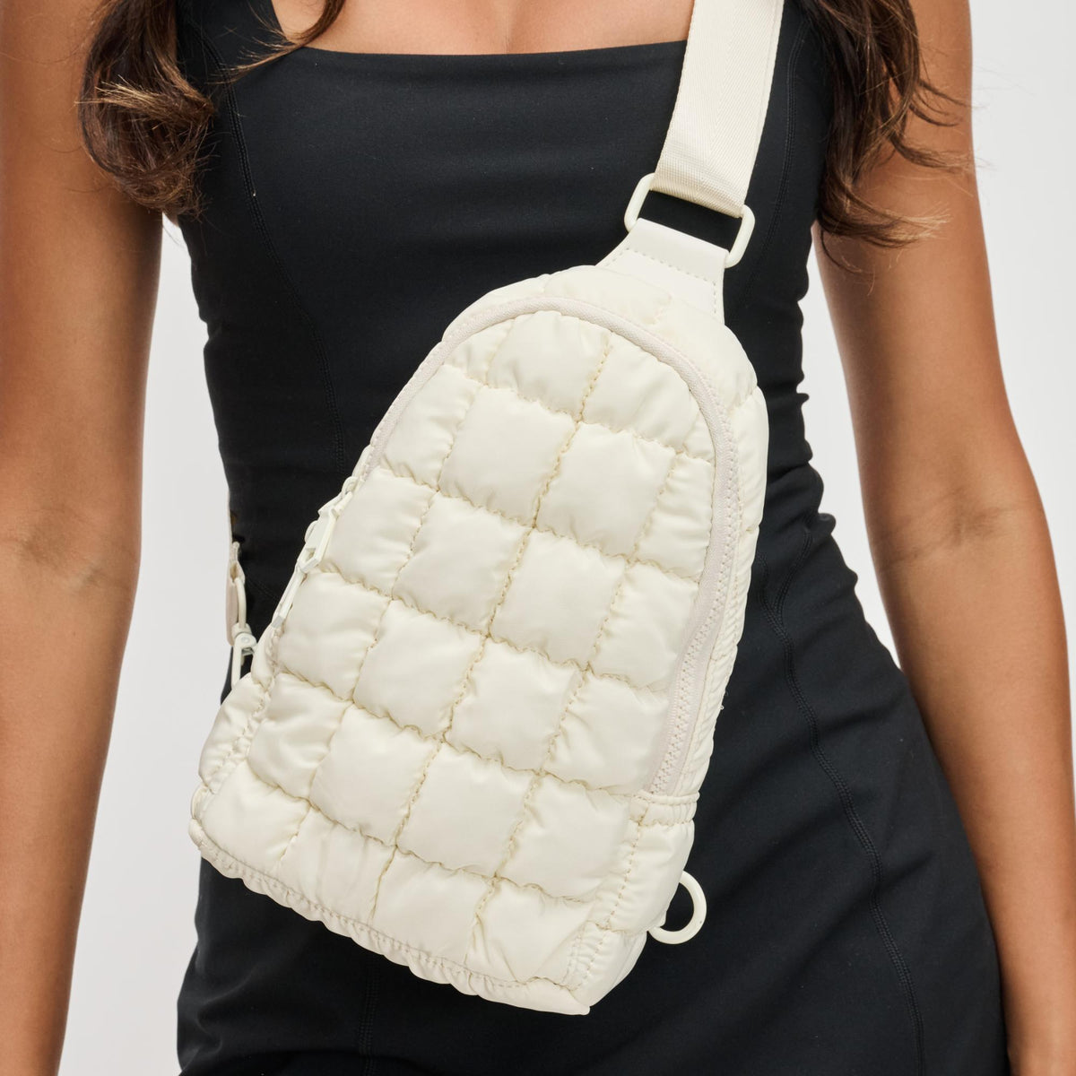 Woman wearing Ivory Sol and Selene Rejuvenate Sling Backpack 841764109604 View 4 | Ivory