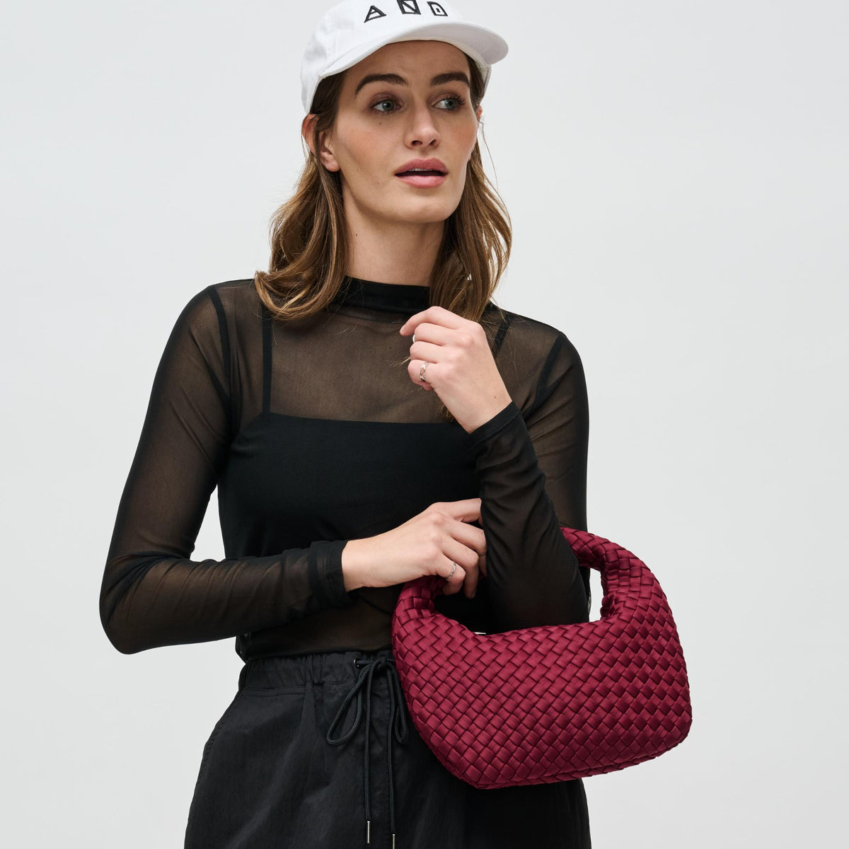 Woman wearing Wine Sol and Selene Dare to Dream - Small Woven Neoprene Clutch 841764111126 View 2 | Wine