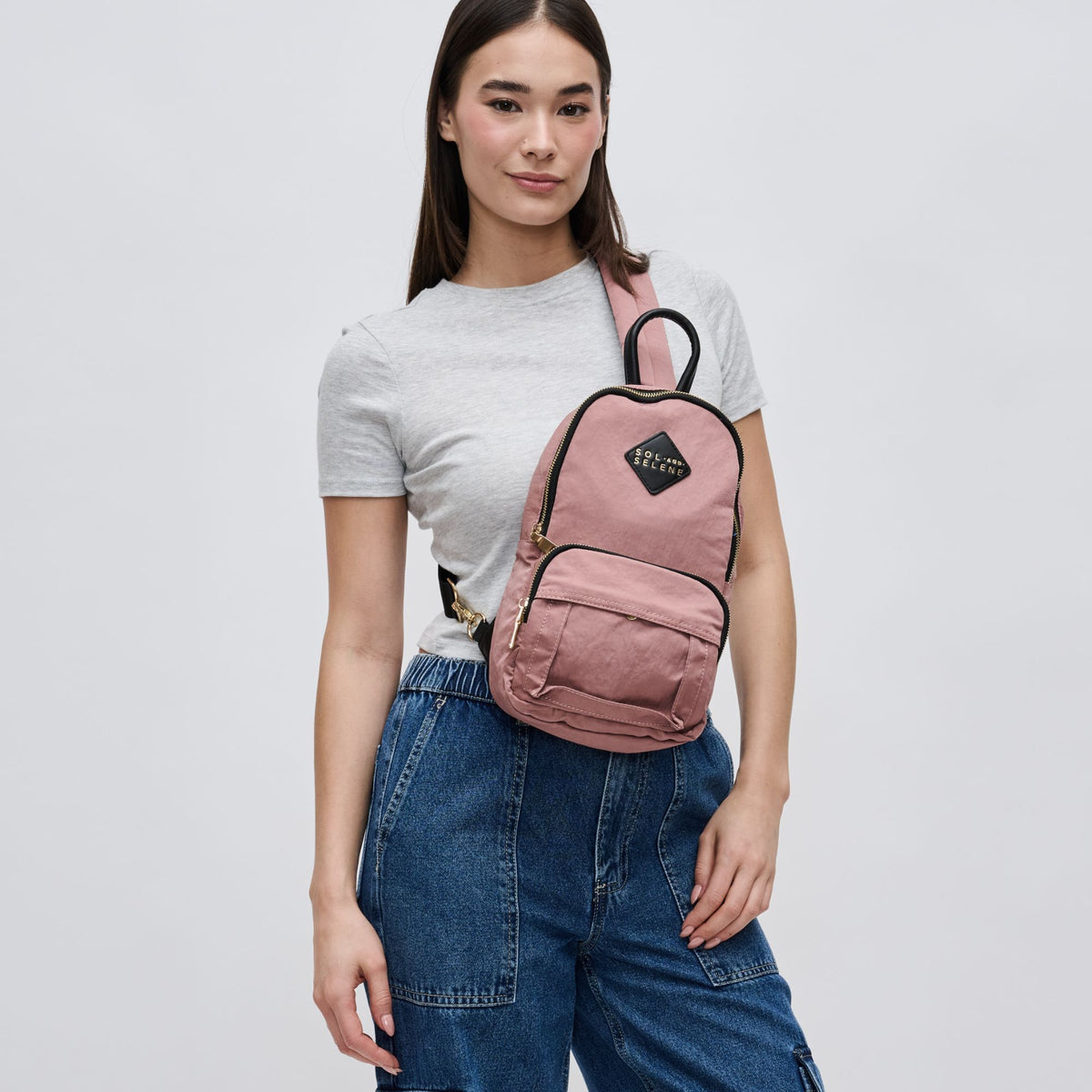 Woman wearing Mauve Sol and Selene Hustle Sling Backpack 841764105576 View 2 | Mauve