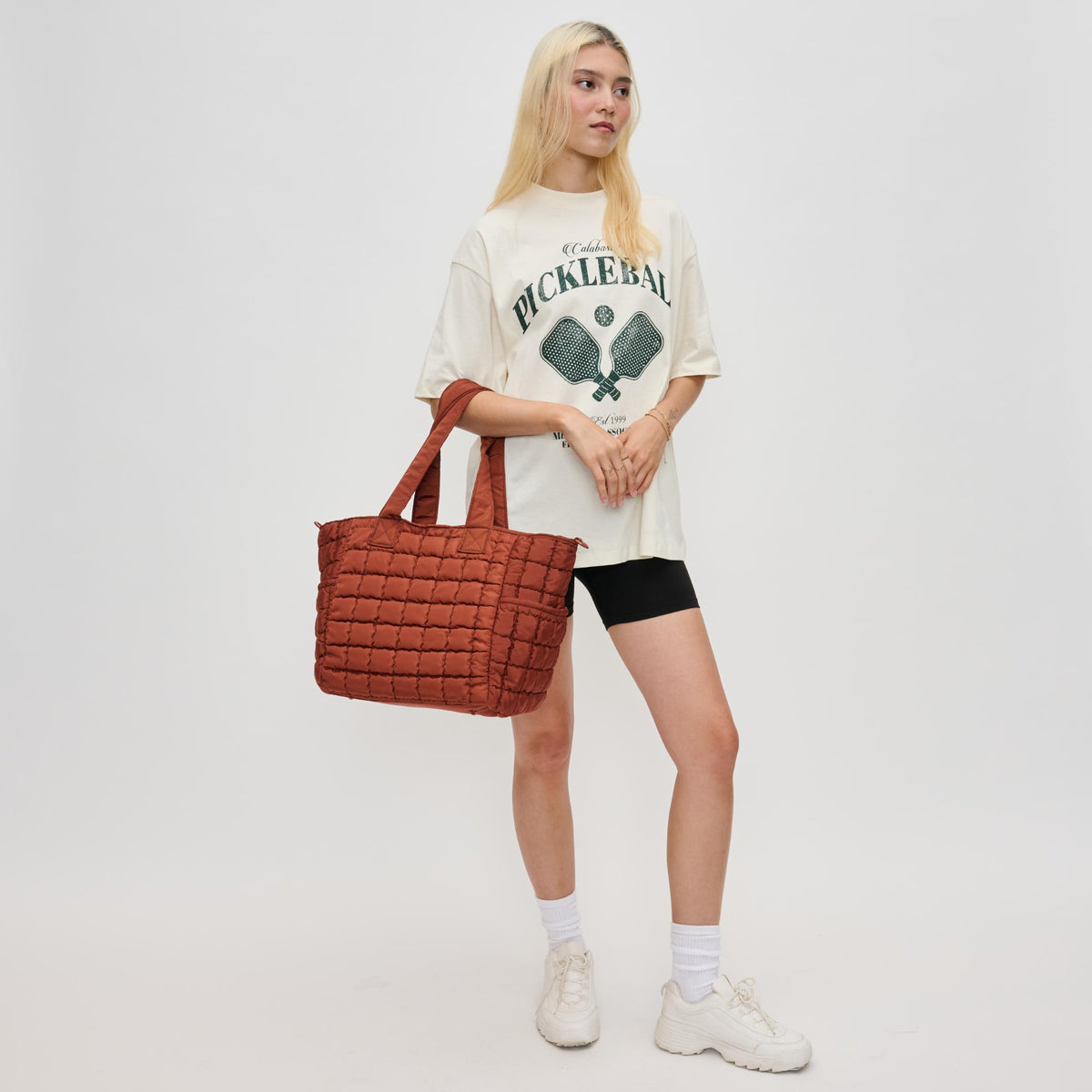 Woman wearing Rust Sol and Selene Dreamer Tote 841764110648 View 3 | Rust