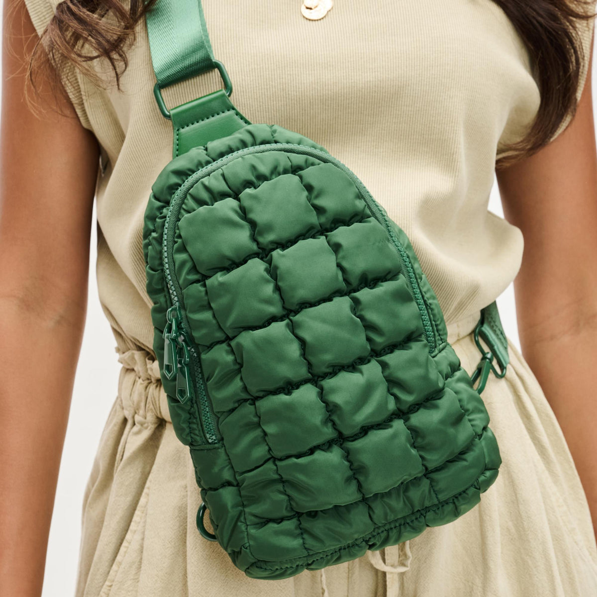 Woman wearing Emerald Sol and Selene Rejuvenate Sling Backpack 841764108645 View 1 | Emerald