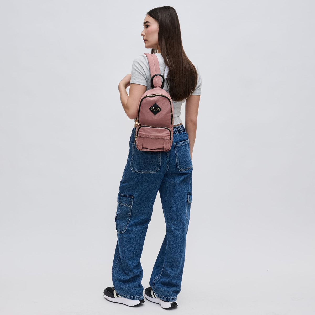 Woman wearing Mauve Sol and Selene Hustle Sling Backpack 841764105576 View 3 | Mauve