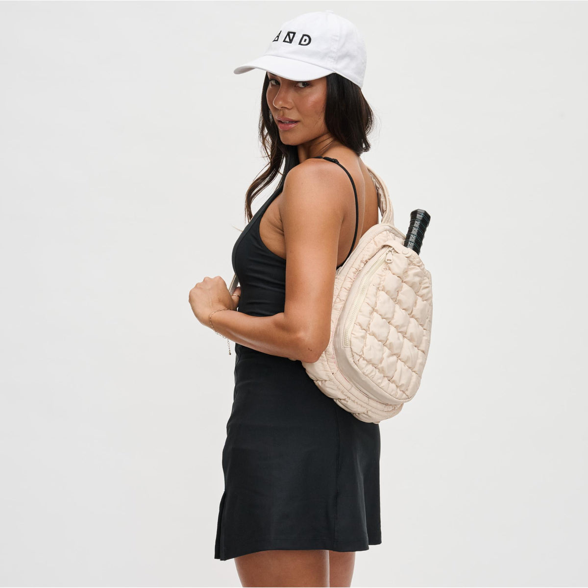 Woman wearing Cream Sol and Selene Match Point - Pickleball Sling Backpack 841764109741 View 2 | Cream