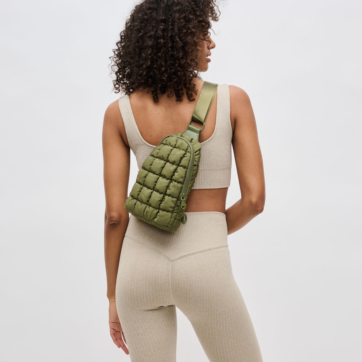 Woman wearing Olive Sol and Selene Rejuvenate Sling Backpack 841764109895 View 2 | Olive