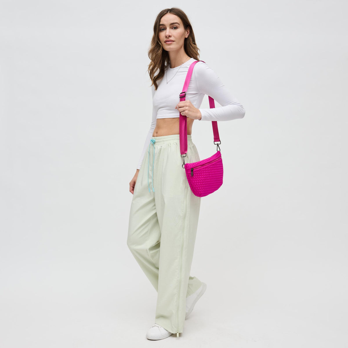 Woman wearing Fuchsia Sol and Selene Ethereal - Woven Neoprene Crossbody 841764110860 View 3 | Fuchsia