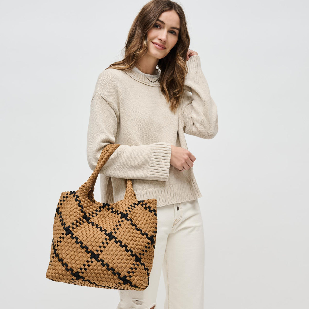 Woman wearing Sand Black Sol and Selene Sky's The Limit - Medium Tote 841764110587 View 2 | Sand Black