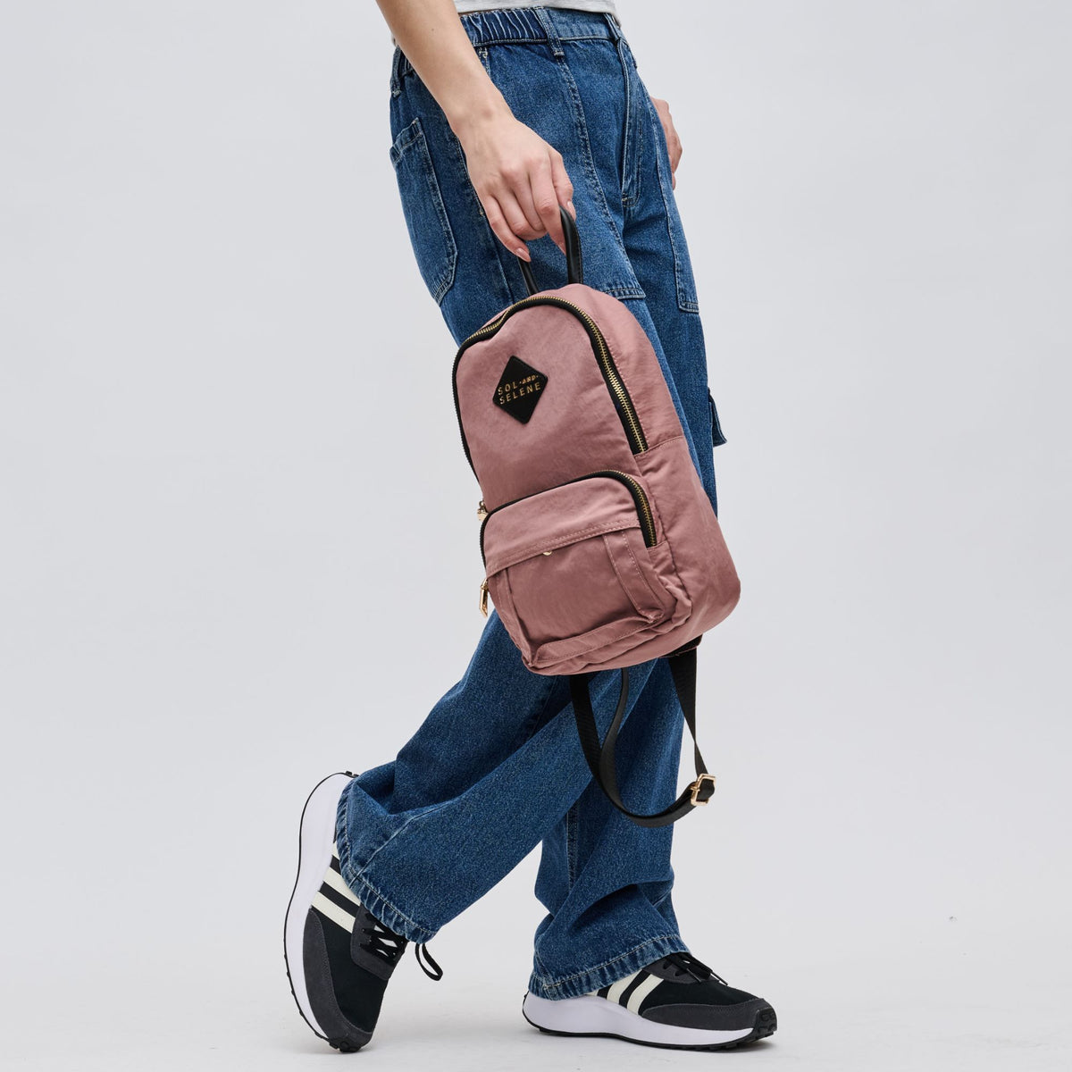 Woman wearing Mauve Sol and Selene Hustle Sling Backpack 841764105576 View 4 | Mauve