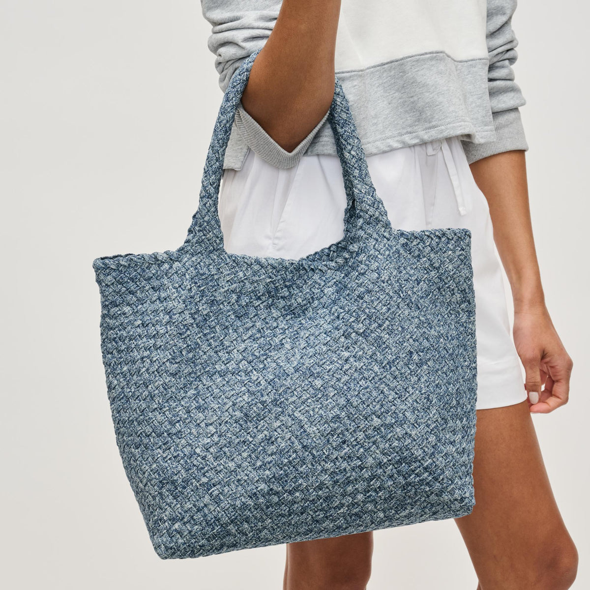 Woman wearing Denim Sol and Selene Sky&#39;s The Limit - Medium Denim Tote 841764111294 View 1 | Denim