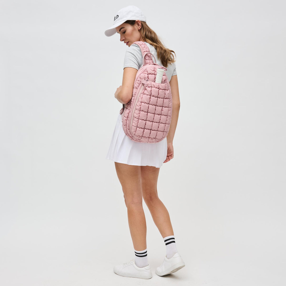 Woman wearing Rose Sol and Selene Match Point - Pickleball & Paddle Tennis Sling Backpack 841764111188 View 2 | Rose