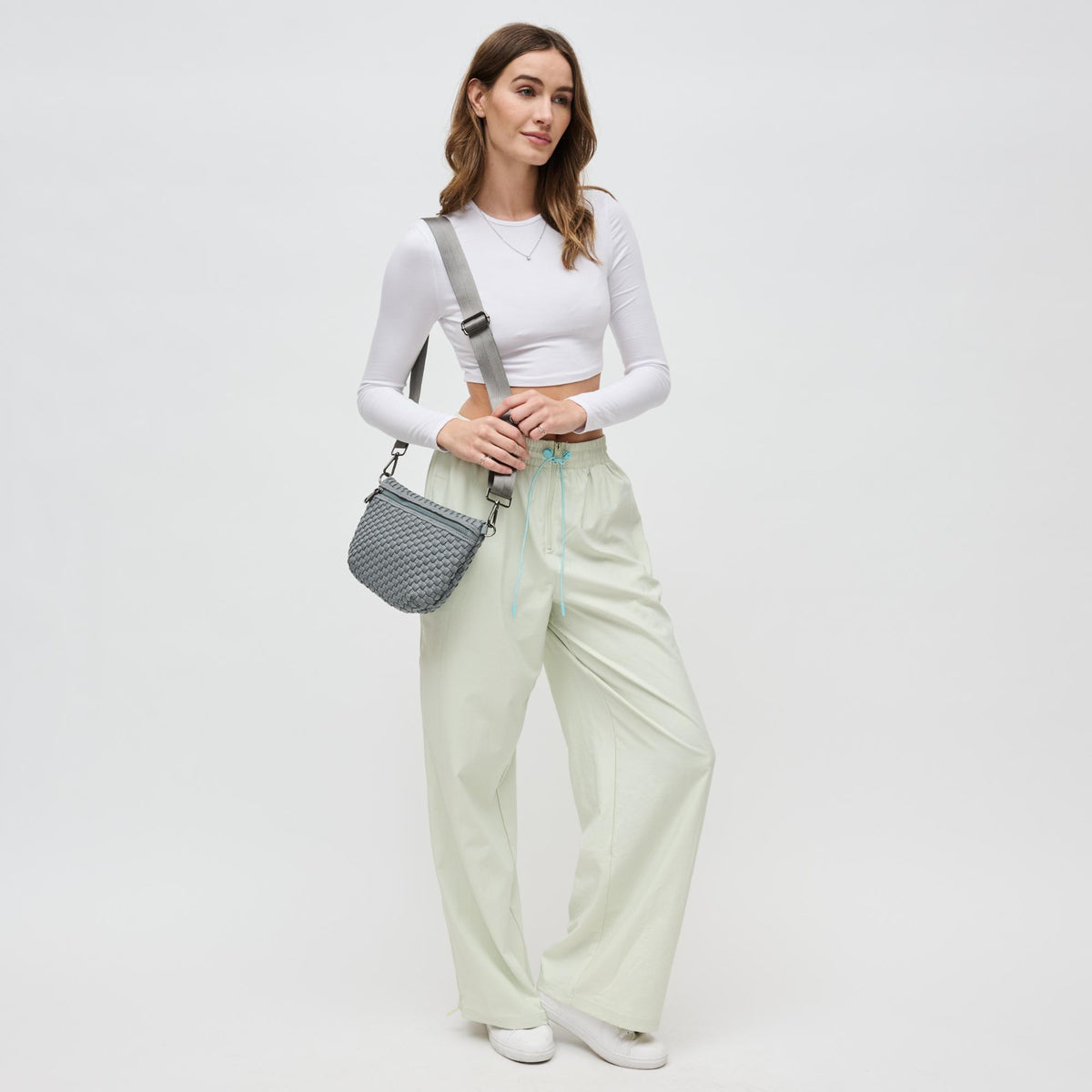 Woman wearing Grey Sol and Selene Ethereal - Woven Neoprene Crossbody 841764110877 View 2 | Grey