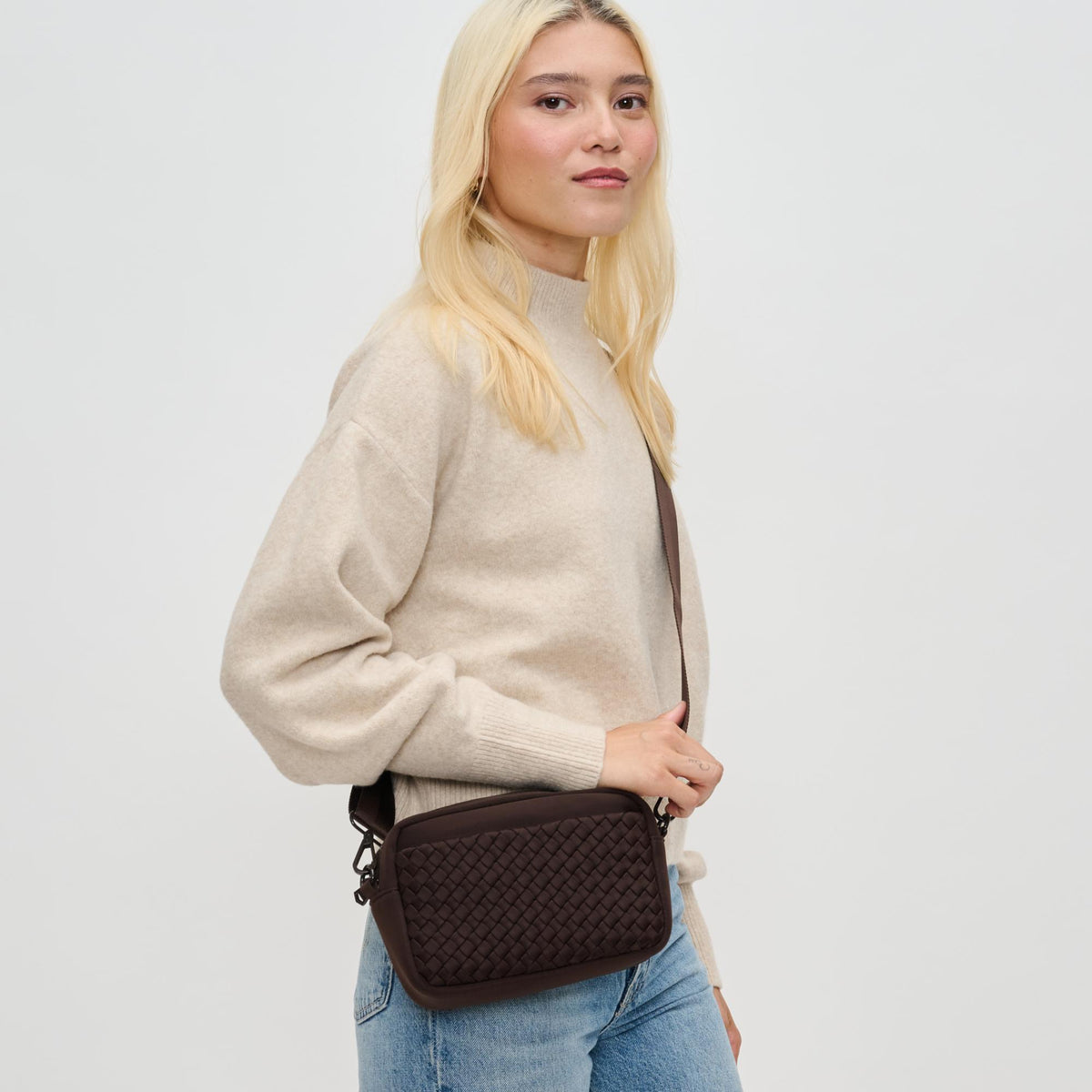 Woman wearing Chocolate Sol and Selene Inspiration - Woven Neoprene Crossbody 841764110495 View 2 | Chocolate