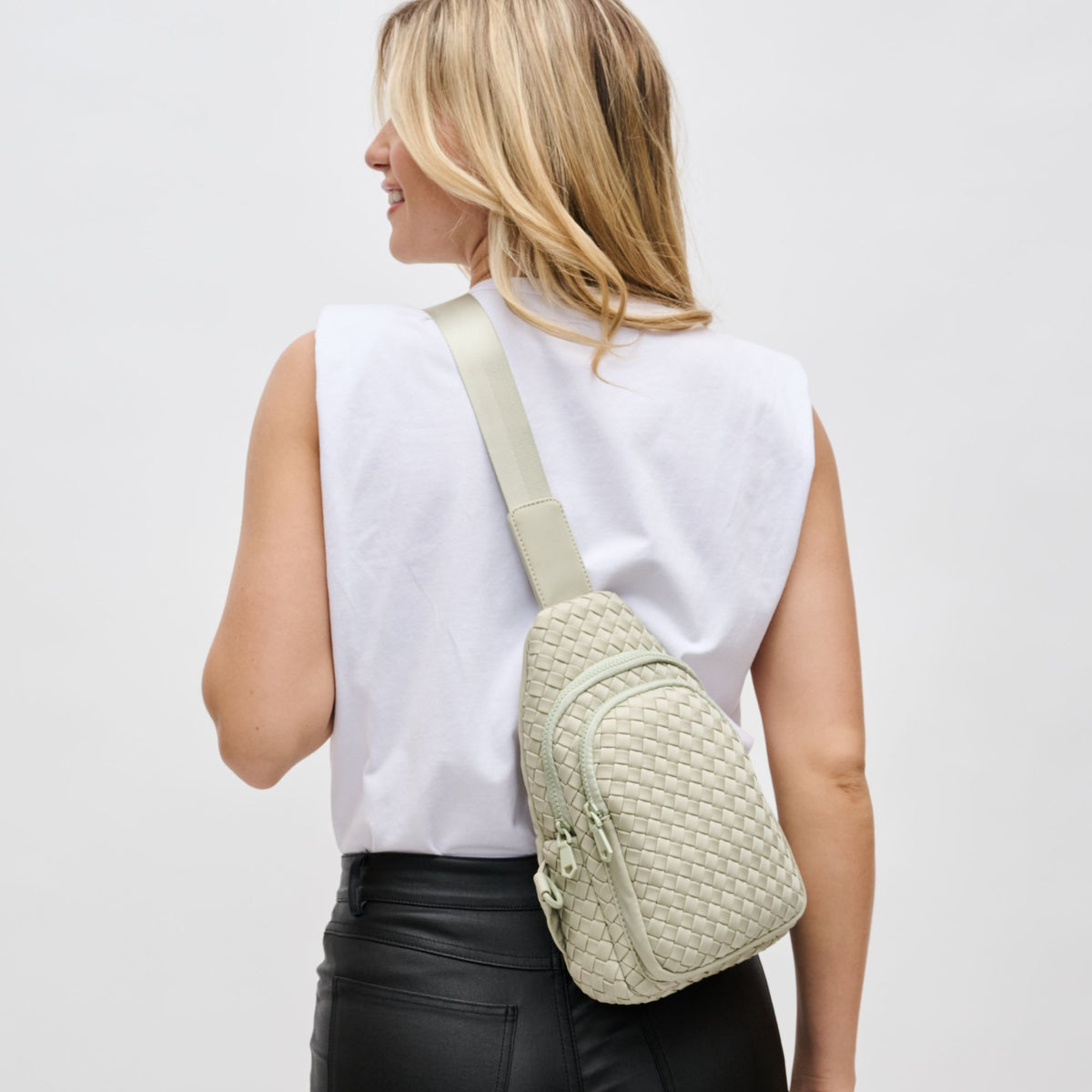 Woman wearing Sage Sol and Selene Beyond The Horizon - Woven Neoprene Sling Backpack 841764109086 View 2 | Sage