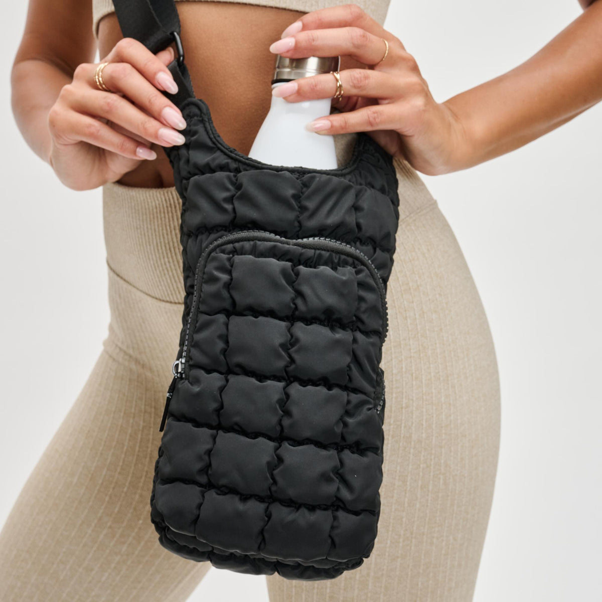 Woman wearing Black Sol and Selene Let It Flow - Quilted Puffer Crossbody 841764110372 View 2 | Black