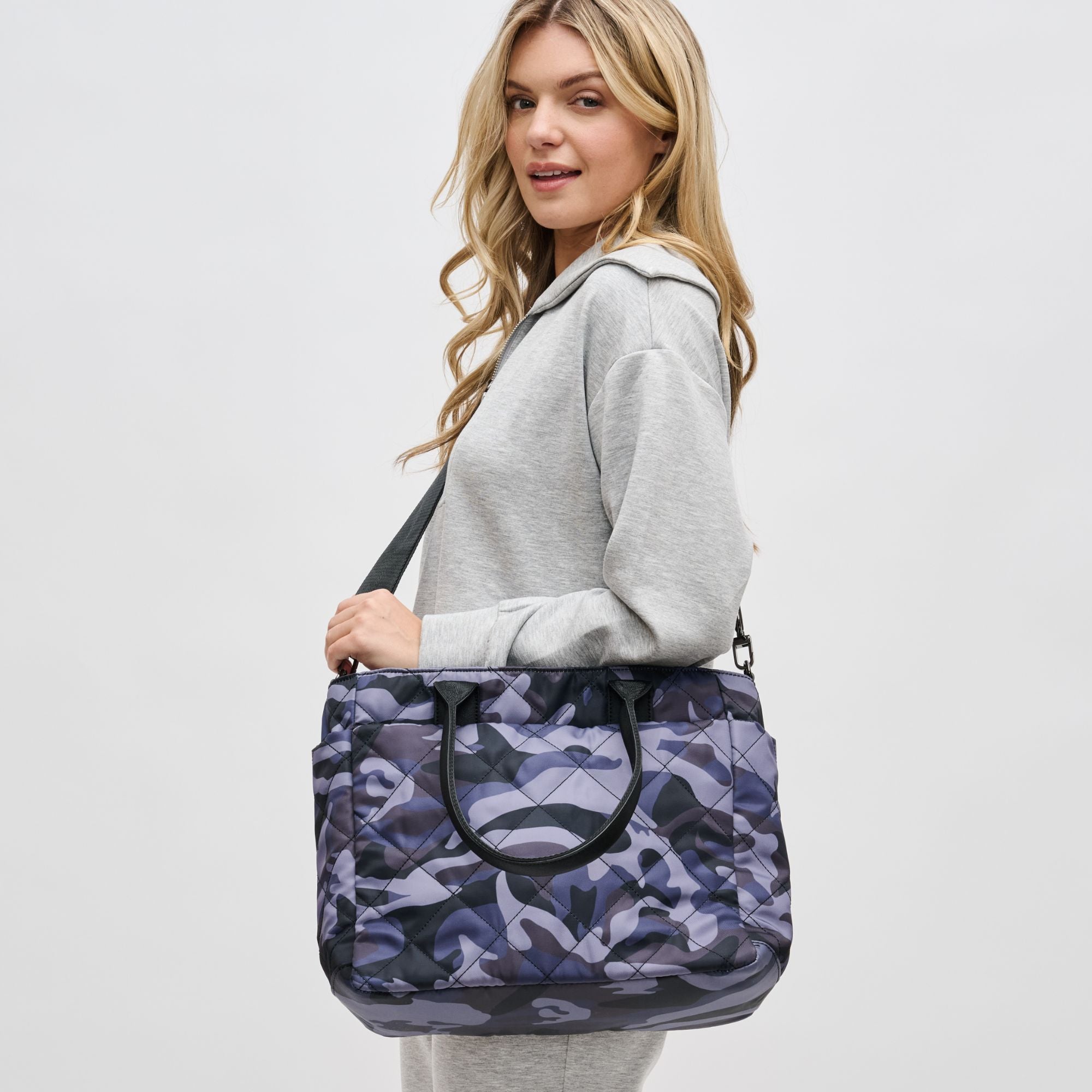 Woman wearing Purple Haze Sol and Selene Motivator East West Tote 841764105705 View 1 | Purple Haze