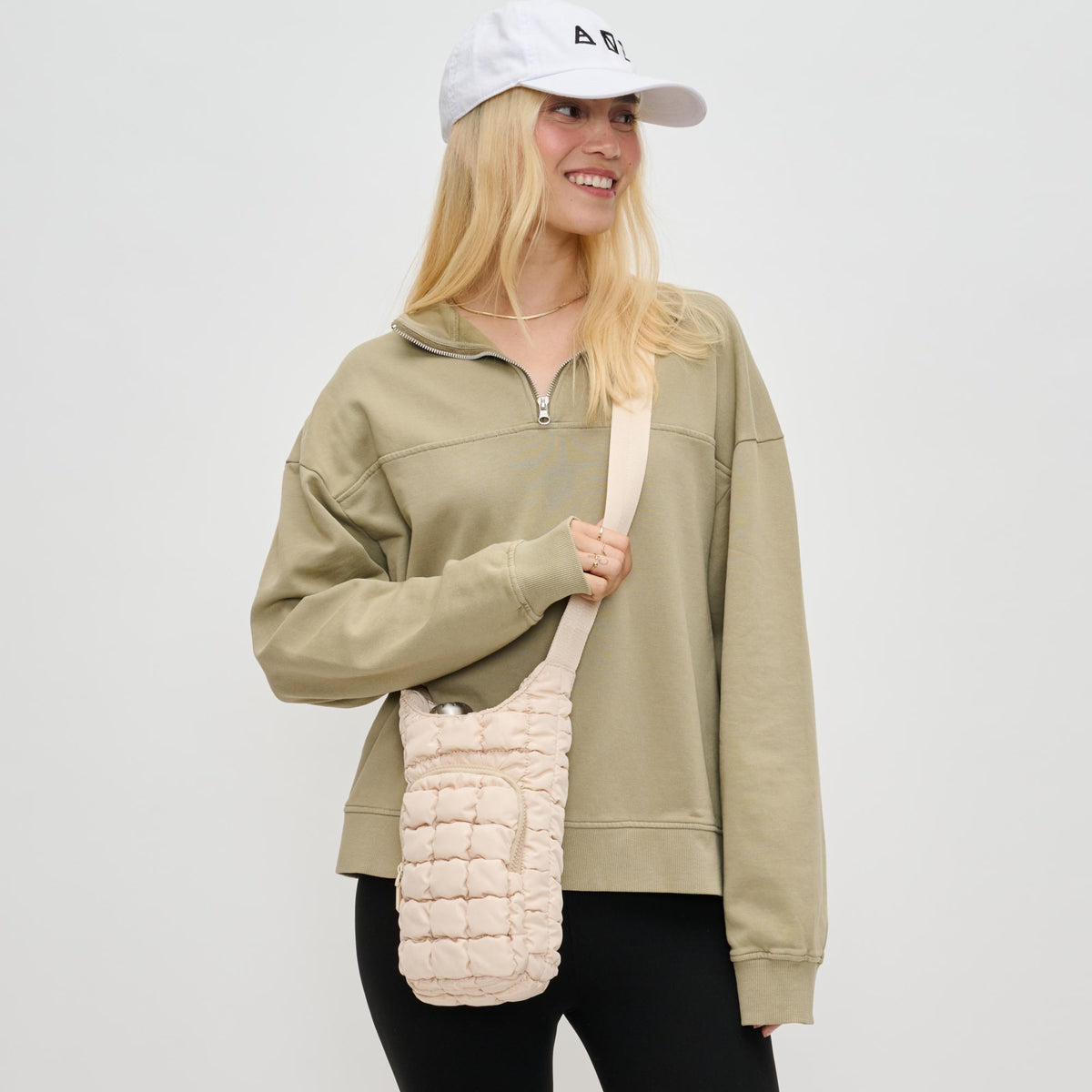 Woman wearing Cream Sol and Selene Let It Flow - Quilted Puffer Crossbody 841764110402 View 1 | Cream