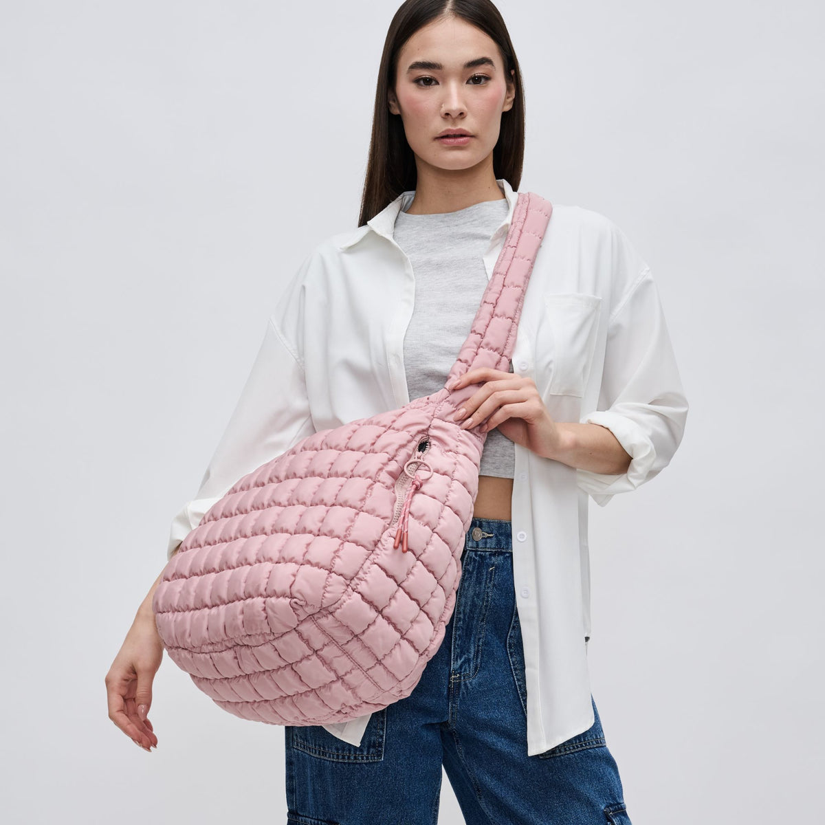 Woman wearing Rose Sol and Selene Revive Hobo 841764109543 View 3 | Rose