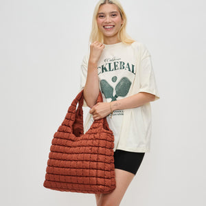 Woman wearing Rust Sol and Selene Elevate Hobo 841764110570 View 1 | Rust