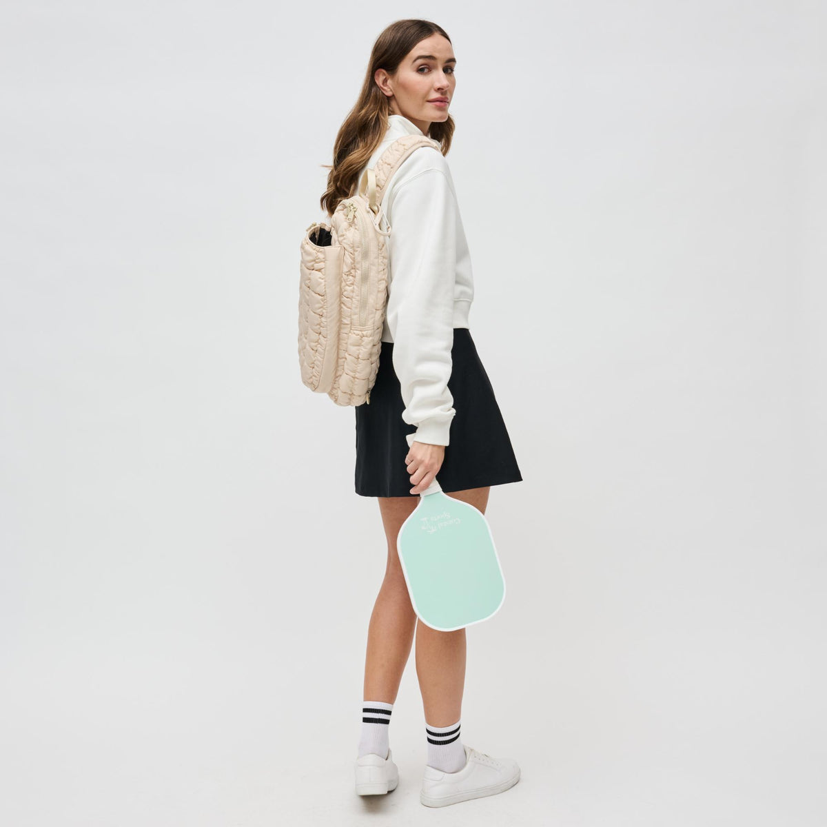 Woman wearing Cream Sol and Selene Match Point - Pickleball &amp; Paddle Tennis Sling Backpack 841764111157 View 3 | Cream