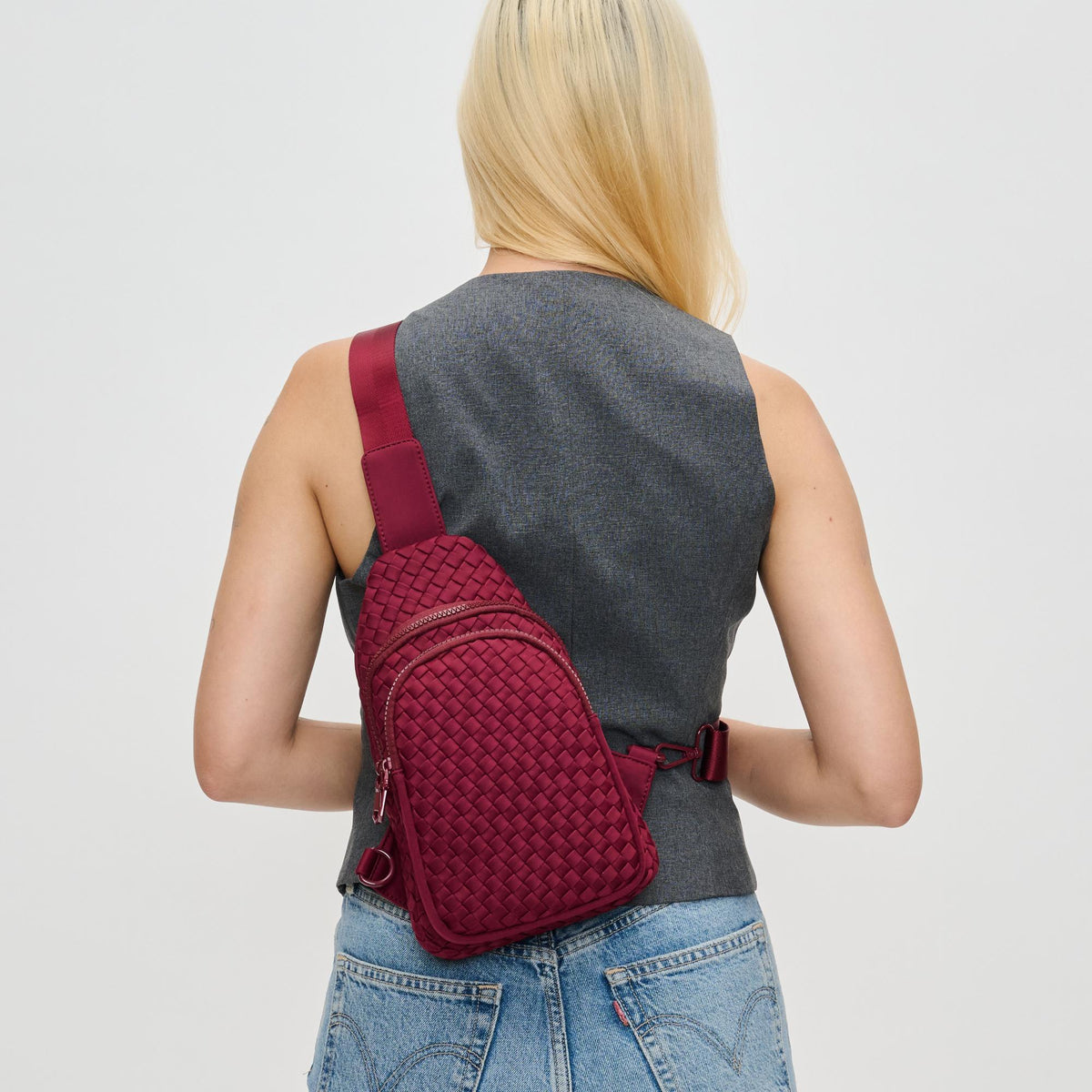 Woman wearing Wine Sol and Selene Beyond The Horizon - Woven Neoprene Sling Backpack 841764110457 View 2 | Wine