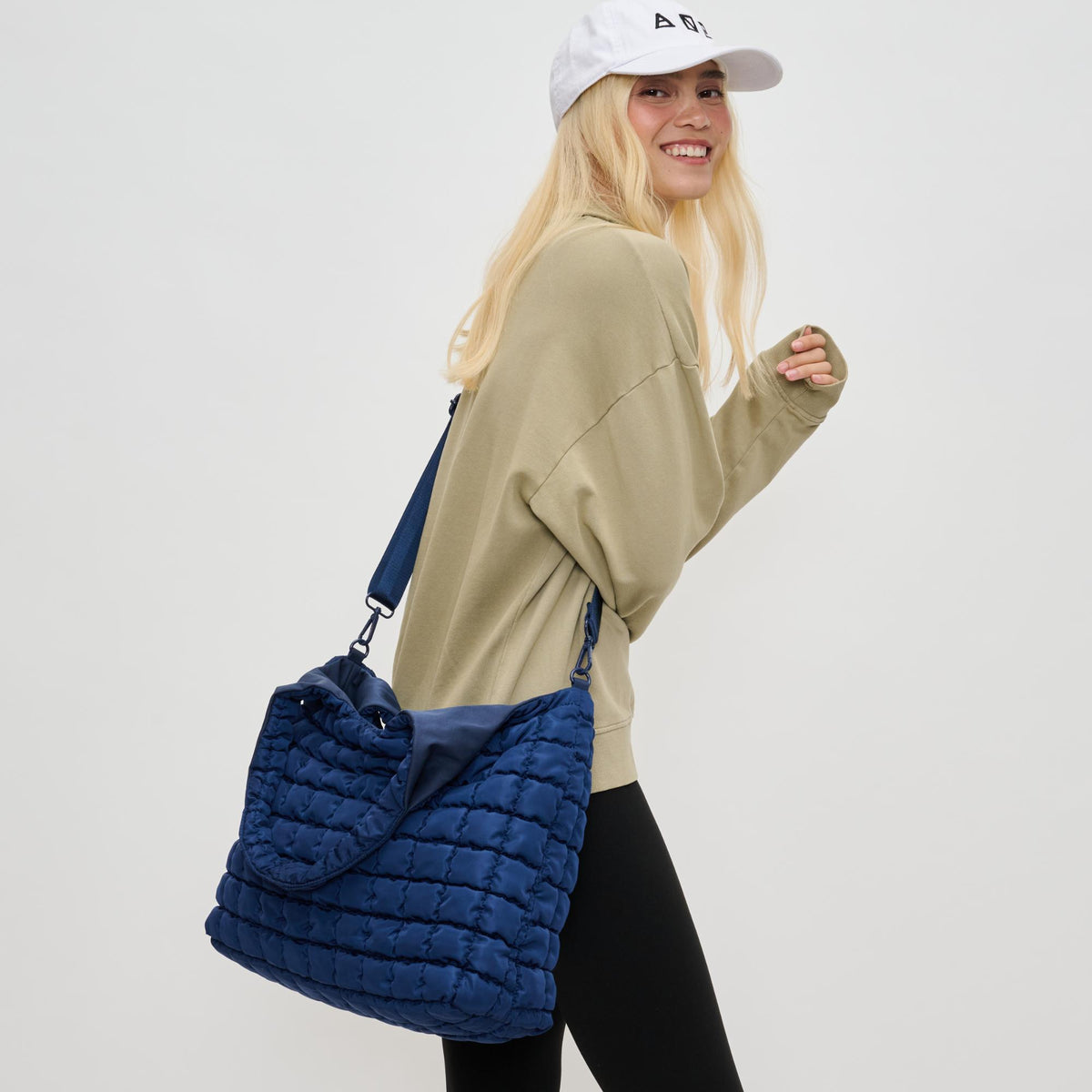 Woman wearing Navy Sol and Selene Elevate Hobo 841764110556 View 2 | Navy