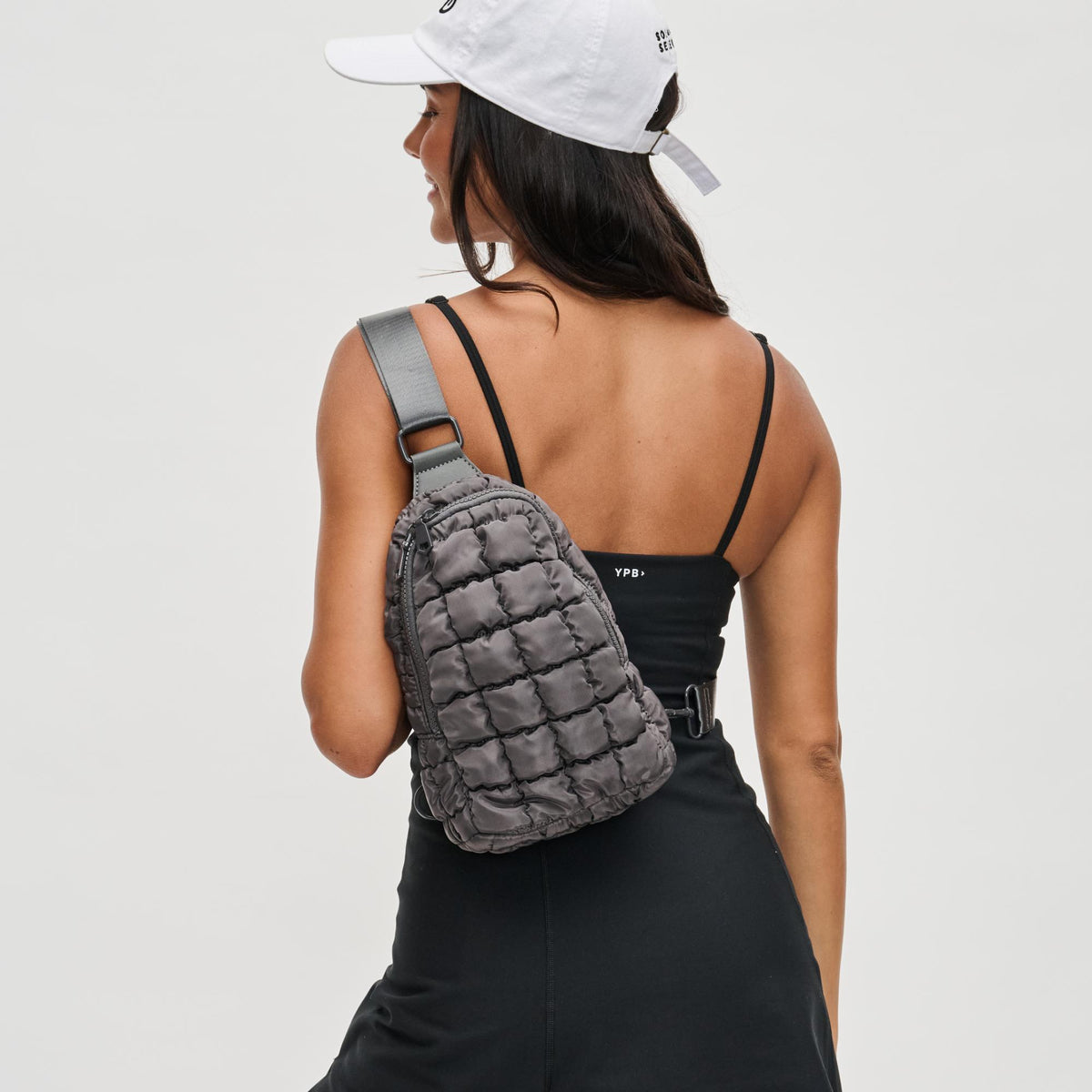 Woman wearing Carbon Sol and Selene Rejuvenate Sling Backpack 841764108638 View 1 | Carbon