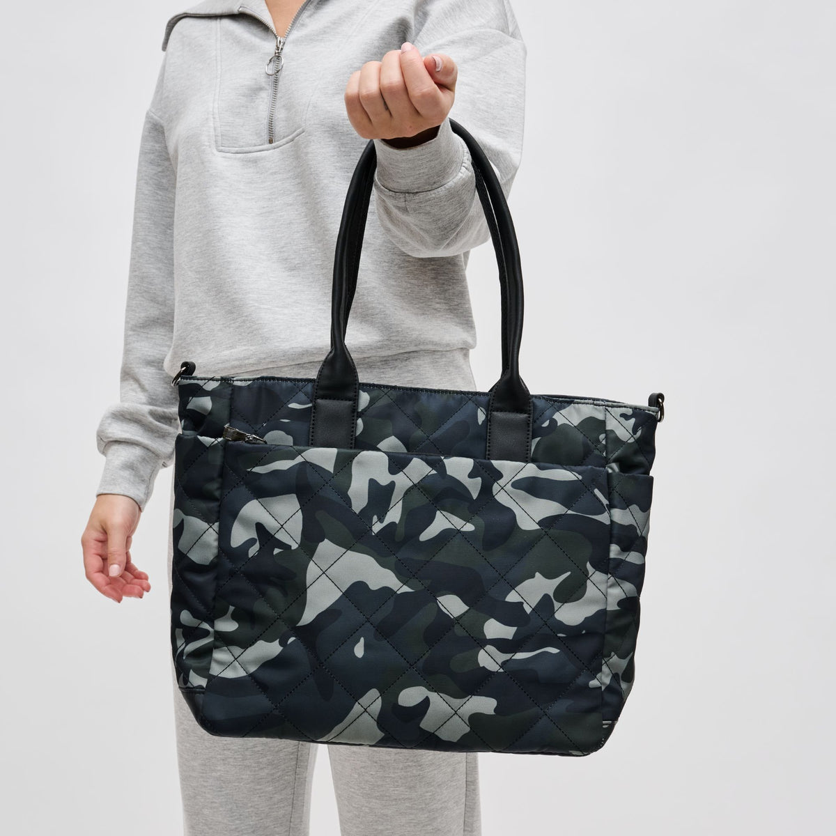 Woman wearing Green Camo Sol and Selene Motivator East West Tote 841764105712 View 1 | Green Camo