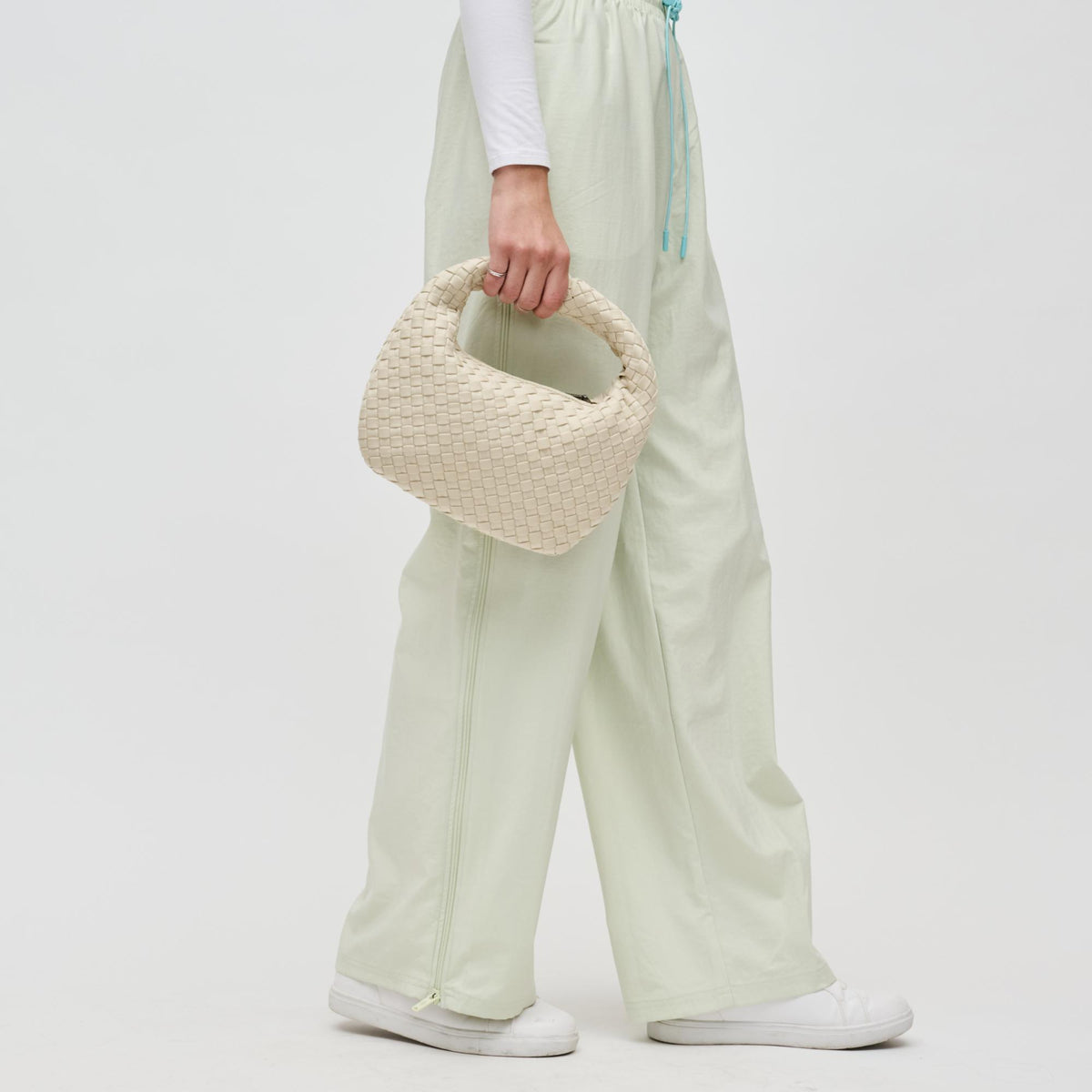 Woman wearing Cream Sol and Selene Dare to Dream - Small Woven Neoprene Clutch 841764111089 View 4 | Cream