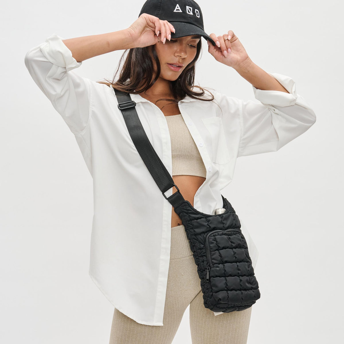 Woman wearing Black Sol and Selene Let It Flow - Quilted Puffer Crossbody 841764110372 View 3 | Black