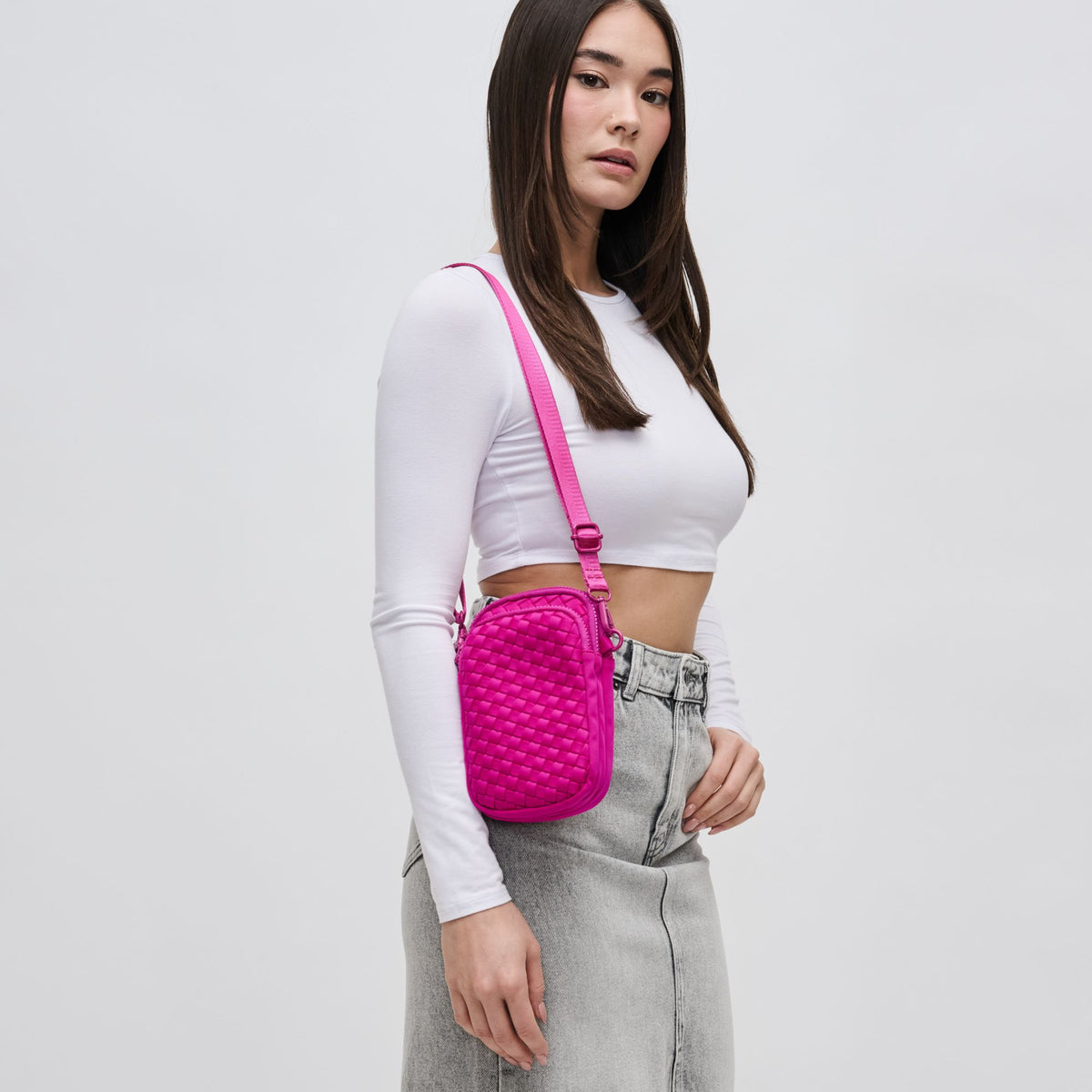 Woman wearing Fuchsia Sol and Selene Divide & Conquer - Woven Neoprene Crossbody 841764108720 View 1 | Fuchsia