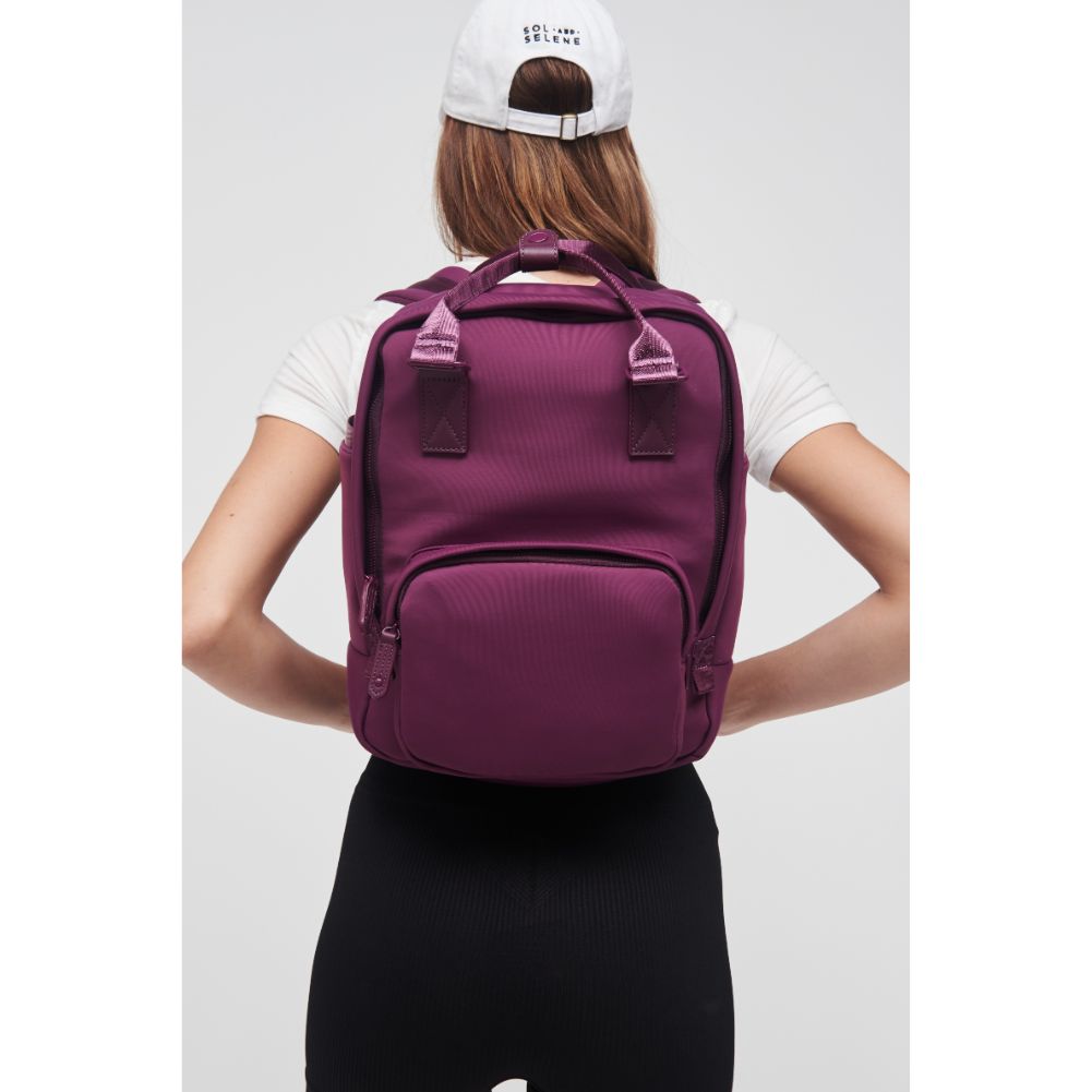 Woman wearing Eggplant Sol and Selene Iconic - Neoprene Backpack 841764106689 View 1 | Eggplant