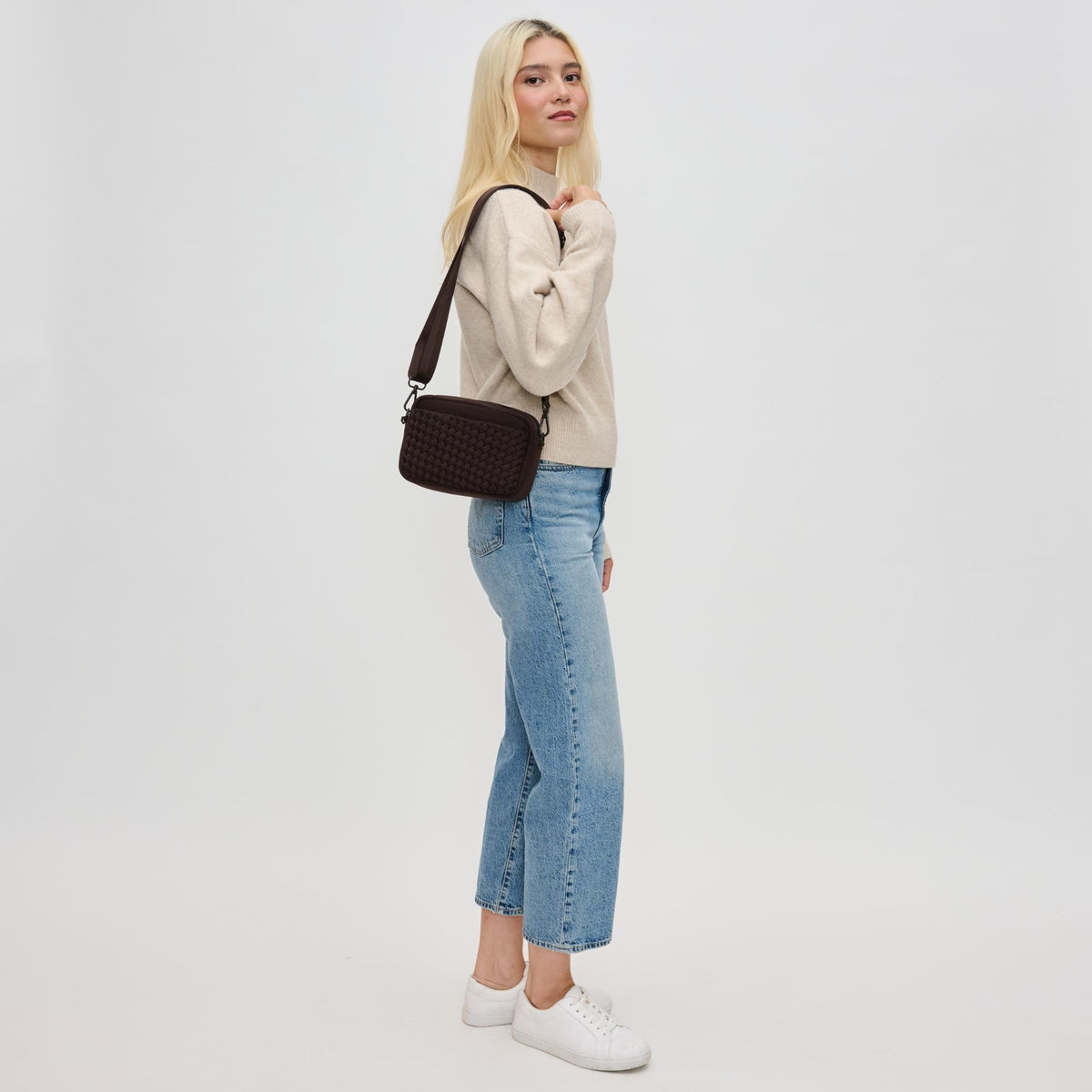 Woman wearing Chocolate Sol and Selene Inspiration - Woven Neoprene Crossbody 841764110495 View 3 | Chocolate