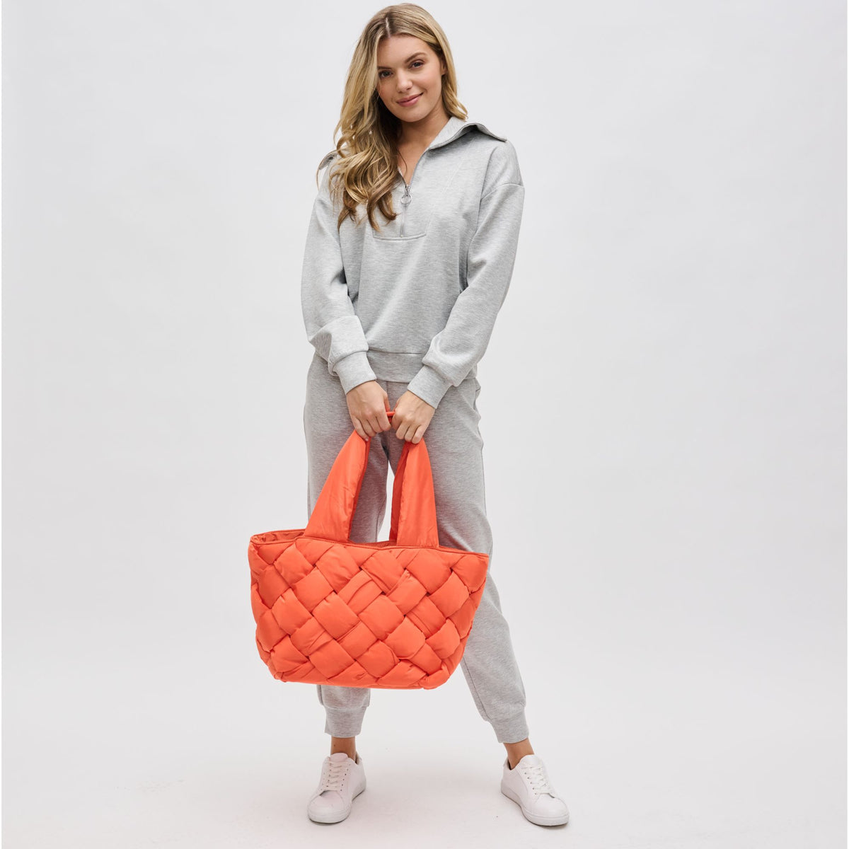 Woman wearing Tangerine Sol and Selene Intuition East West Tote 841764107310 View 3 | Tangerine