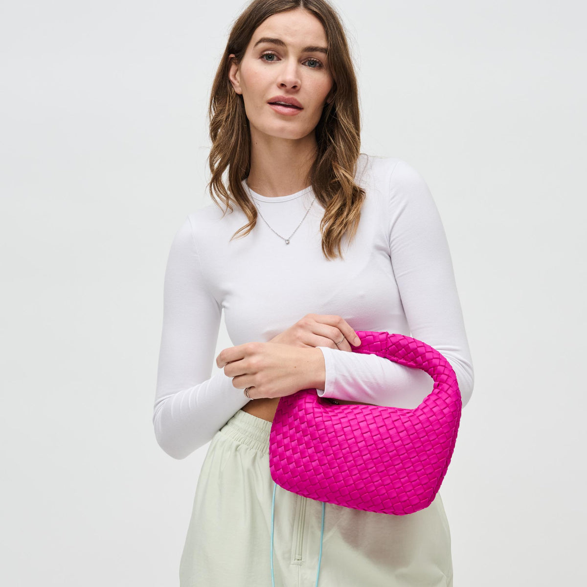 Woman wearing Fuchsia Sol and Selene Dare to Dream - Small Woven Neoprene Clutch 841764111102 View 2 | Fuchsia