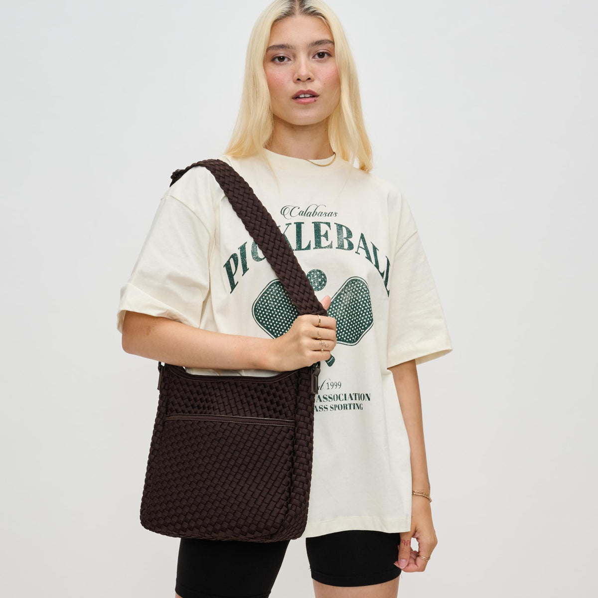 Woman wearing Chocolate Sol and Selene Kismet - Woven Neoprene Crossbody 841764110167 View 1 | Chocolate