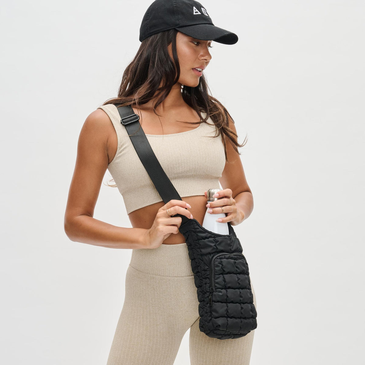 Woman wearing Black Sol and Selene Let It Flow - Quilted Puffer Crossbody 841764110372 View 1 | Black