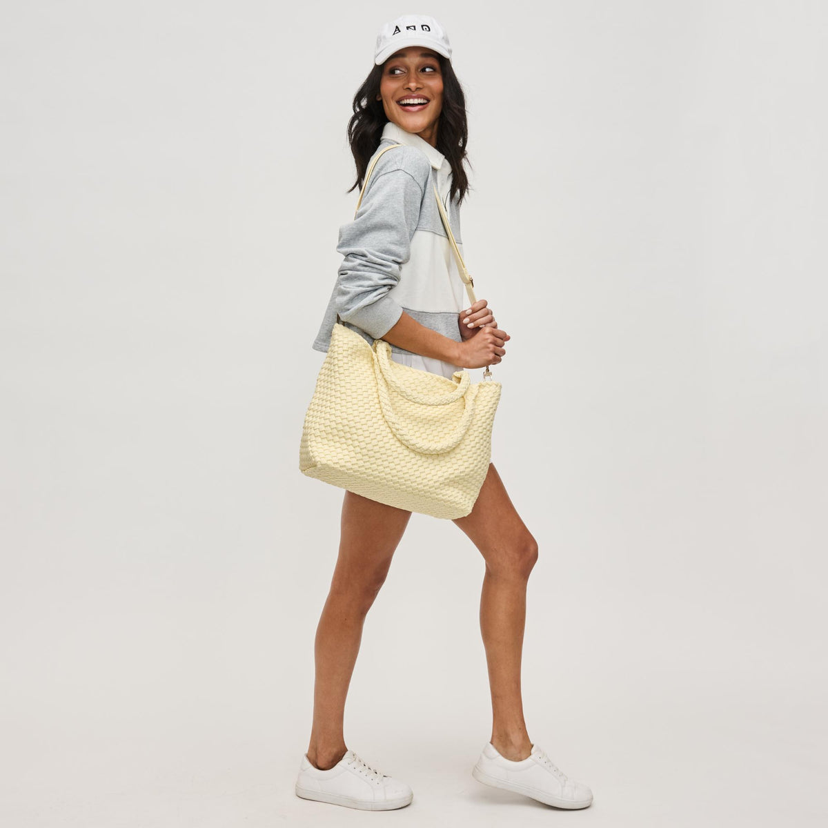 Woman wearing Butter Sol and Selene Sky&#39;s The Limit - Medium Sustainable Tote 841764111607 View 4 | Butter