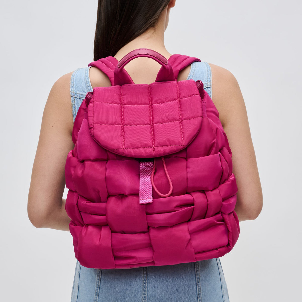 Woman wearing Magenta Sol and Selene Perception Backpack 841764107945 View 1 | Magenta